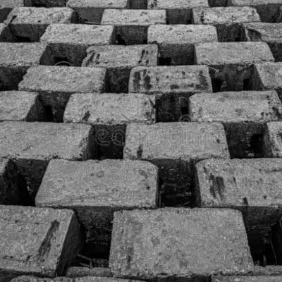 Uniform interlocking concrete block laid in a running bond